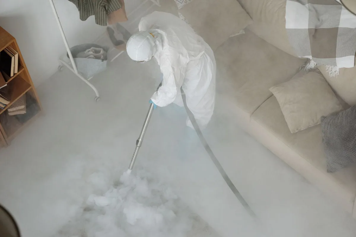 Biohazard cleanup technician in protective equipment, Ashdown, AR